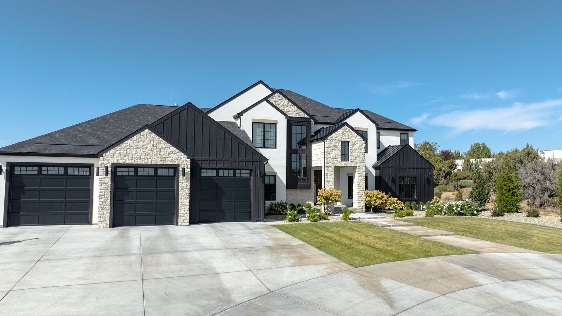 Elevated angle of a completed architectural shingle roofing system on a custom residence