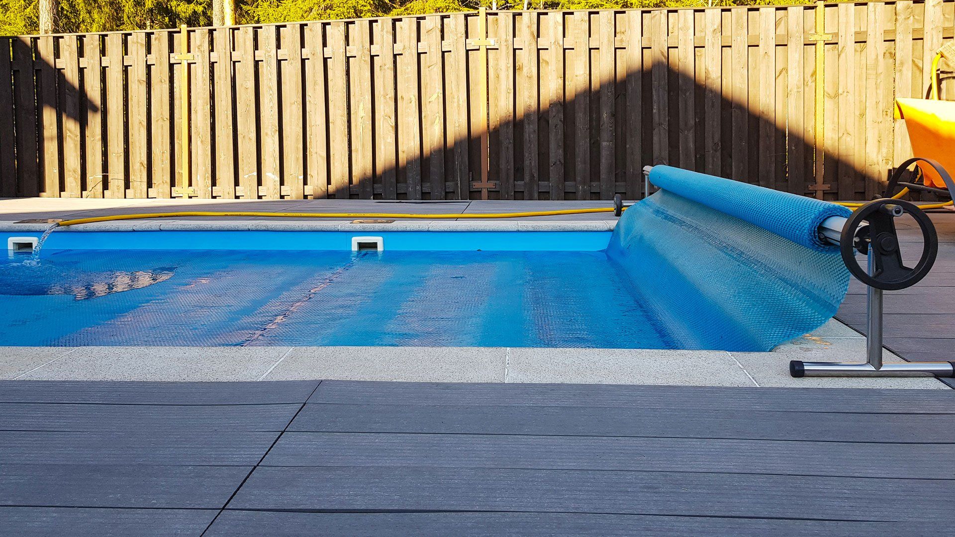 A pool cover with a roller | Penrith, NSW | Ian’s Pools Penrith A pool cover with a roller | Penrith, NSW | Ian’s Pools Penrith
