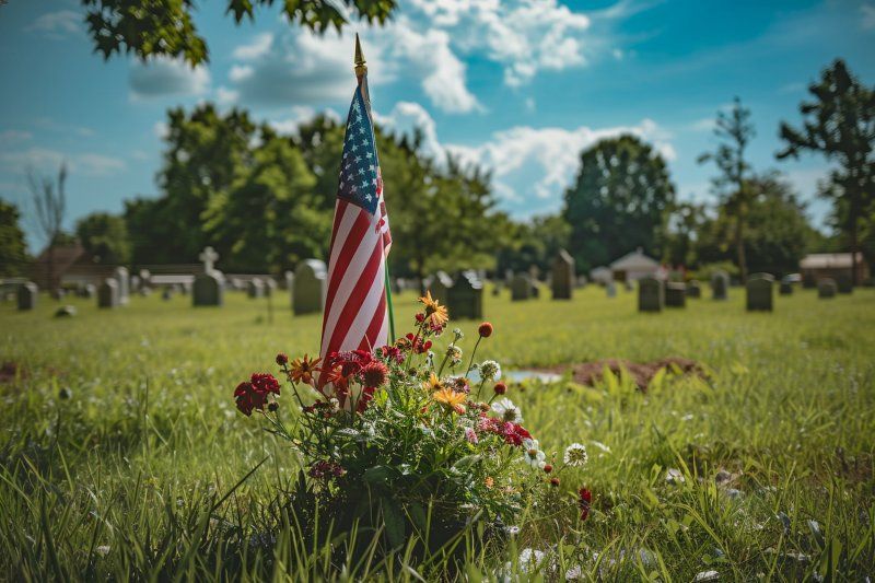 American flag and flowers for Allentown, PA Veteran Services in a peaceful cemetery setting