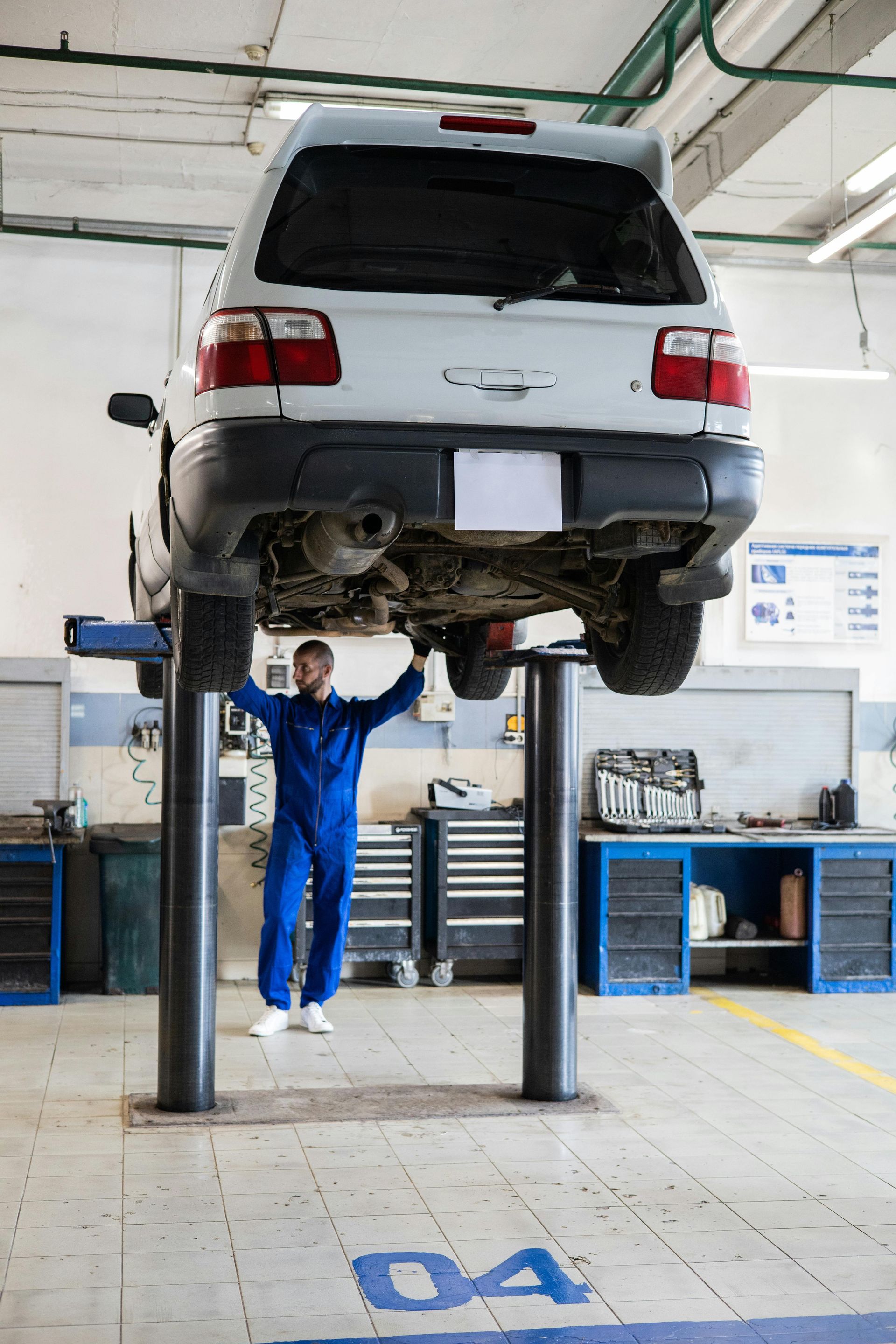 Vehicle Lifted For Undercar Inspection And Repair | Central Automotive