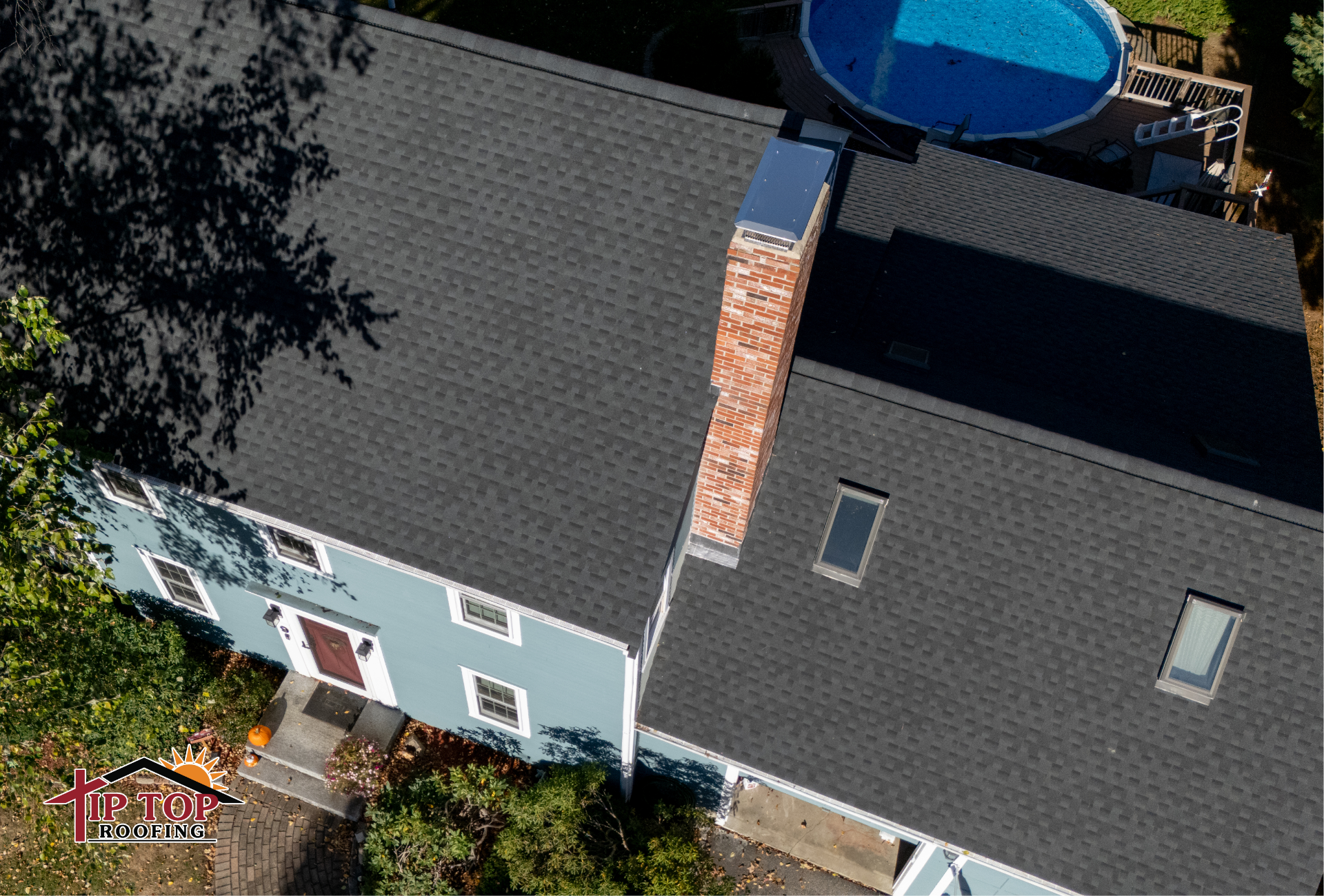 A residential home with a newly installed architectural shingle roof.