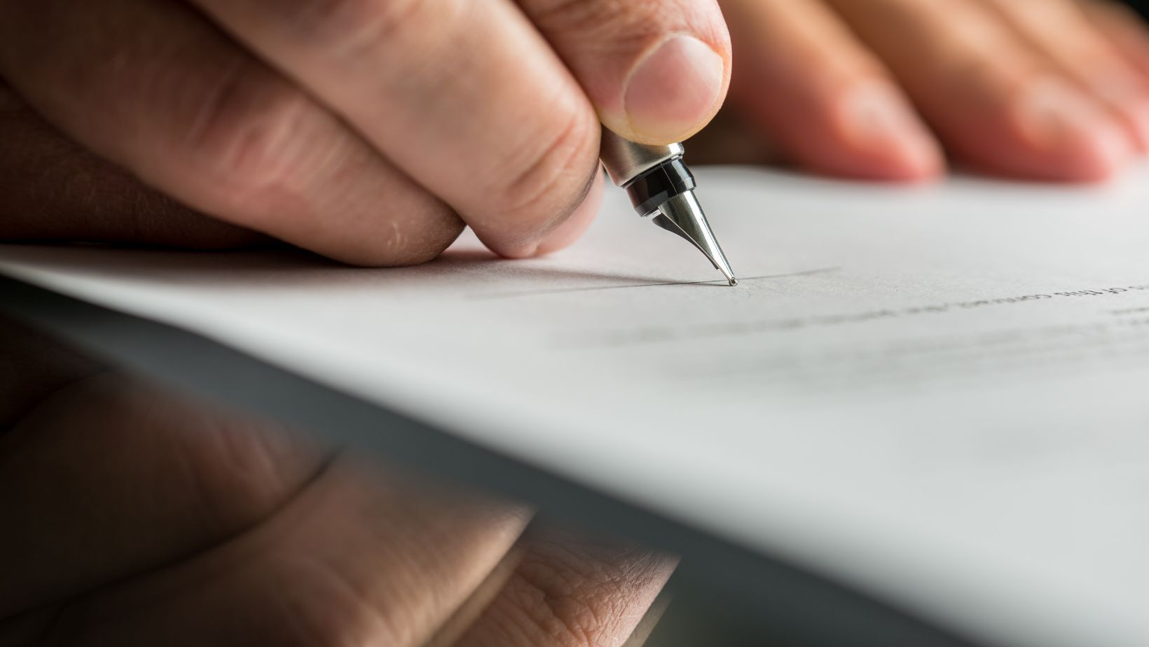 Landlord and tenant signing a lease