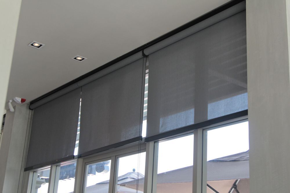 A Large Window With Roller Blinds on It — Port Blinds & Awnings In Coffs Harbour, NSW