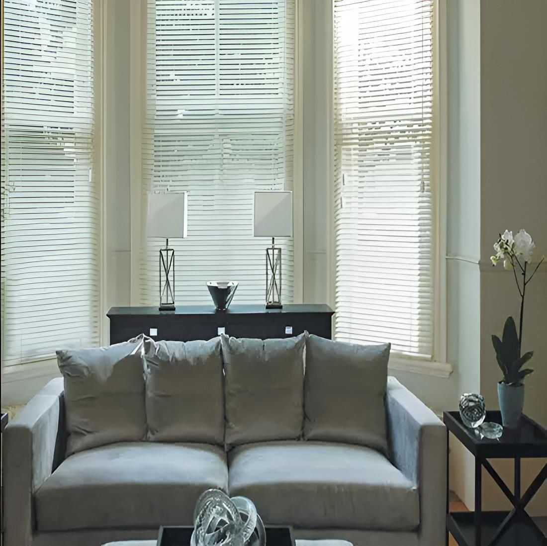 A Living Room With a Couch and Two Lamps — Port Blinds & Awnings In Port Macquarie, NSW