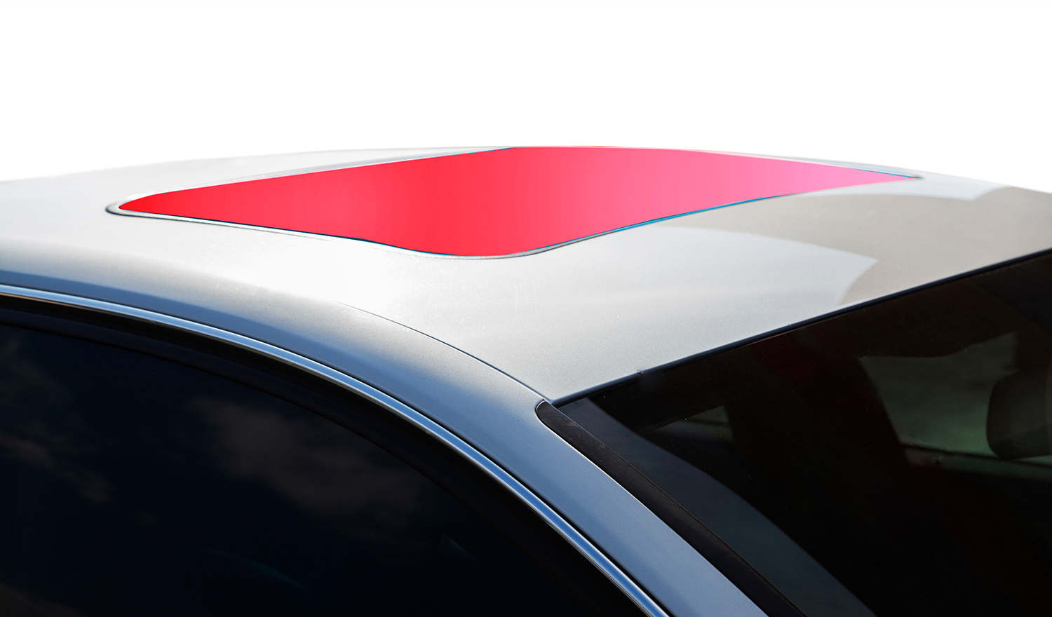 A white car with a sunroof that is green