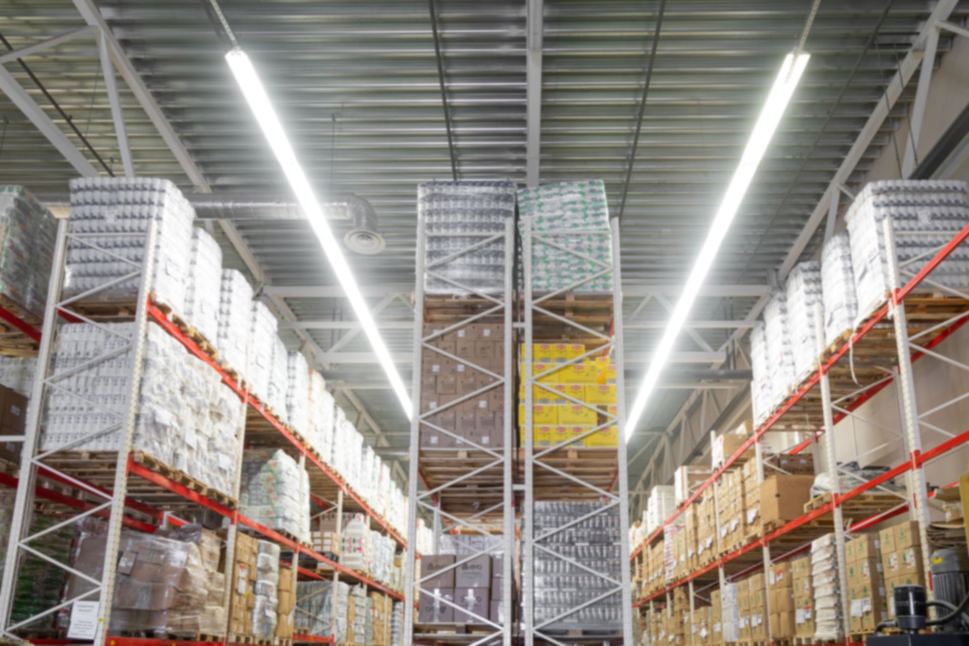 A large warehouse filled with lots of shelves and boxes.