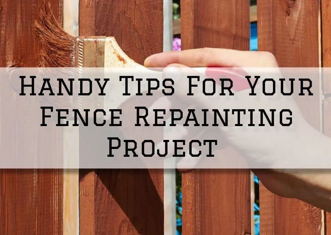 Hand painting a wooden fence with a brush, text reads