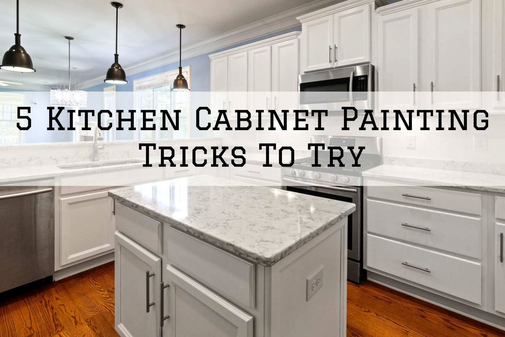 White kitchen with island and overhead lights; text overlay