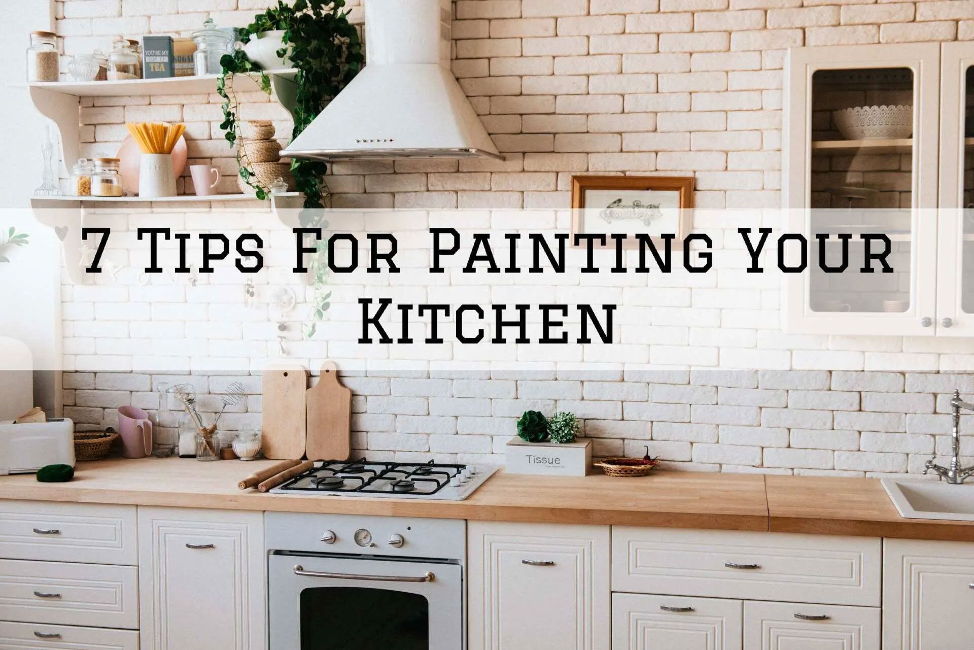 Kitchen with white brick wall, wooden countertop, stove, cabinets, and headline: