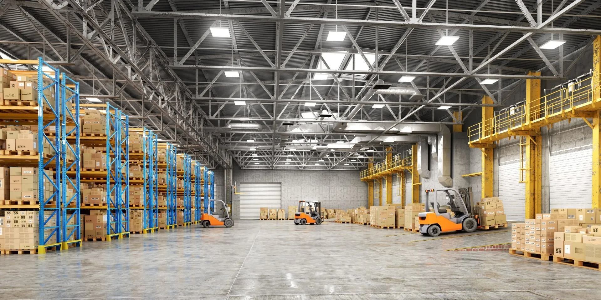 Warehouse interior with boxes stacked on shelves and forklifts.