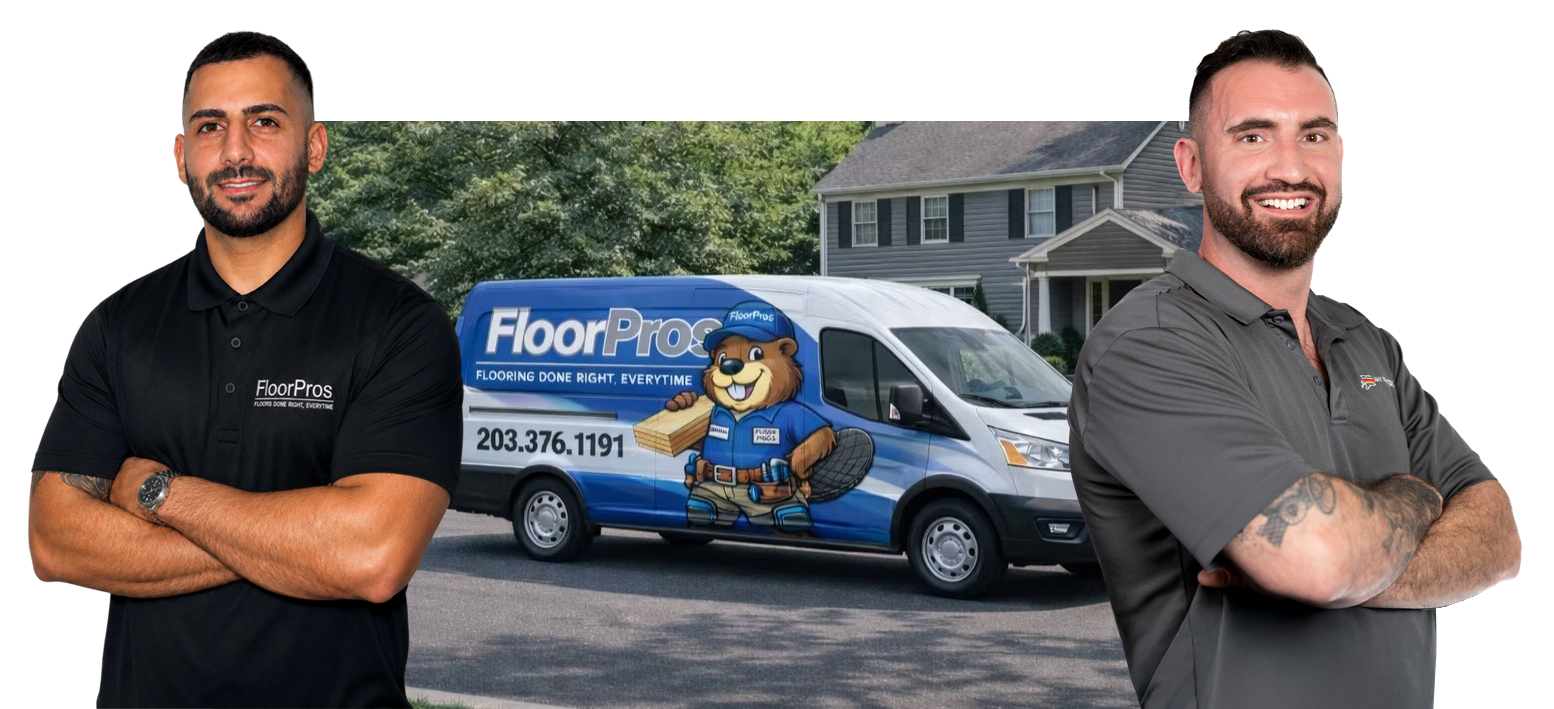 Mike Jaser and Glenn Williamson of NHV FLoors beside a FloorPro van with a house in the background.