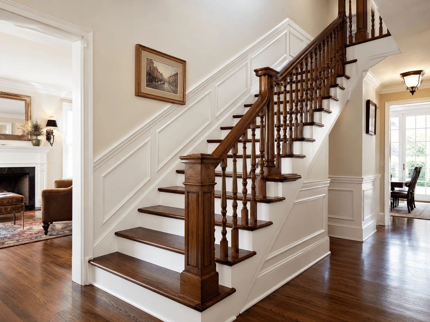 Wooden staircase with white trim in a bright entry hall, leading to an upper floor