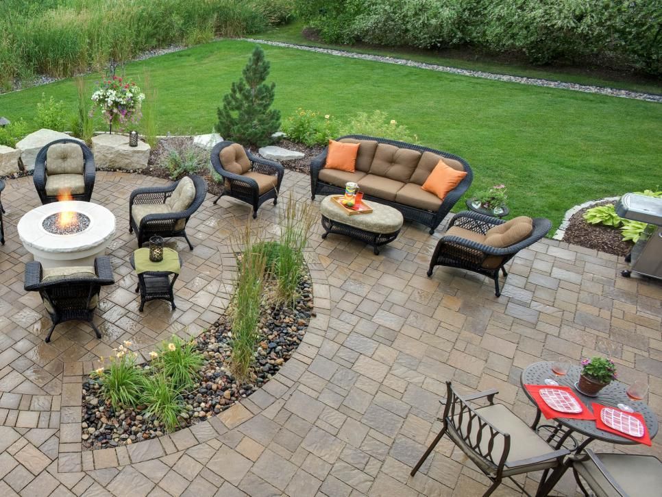 Brick paved patio adorned with comfortable patio furniture, perfect for outdoor relaxation and entertainment.