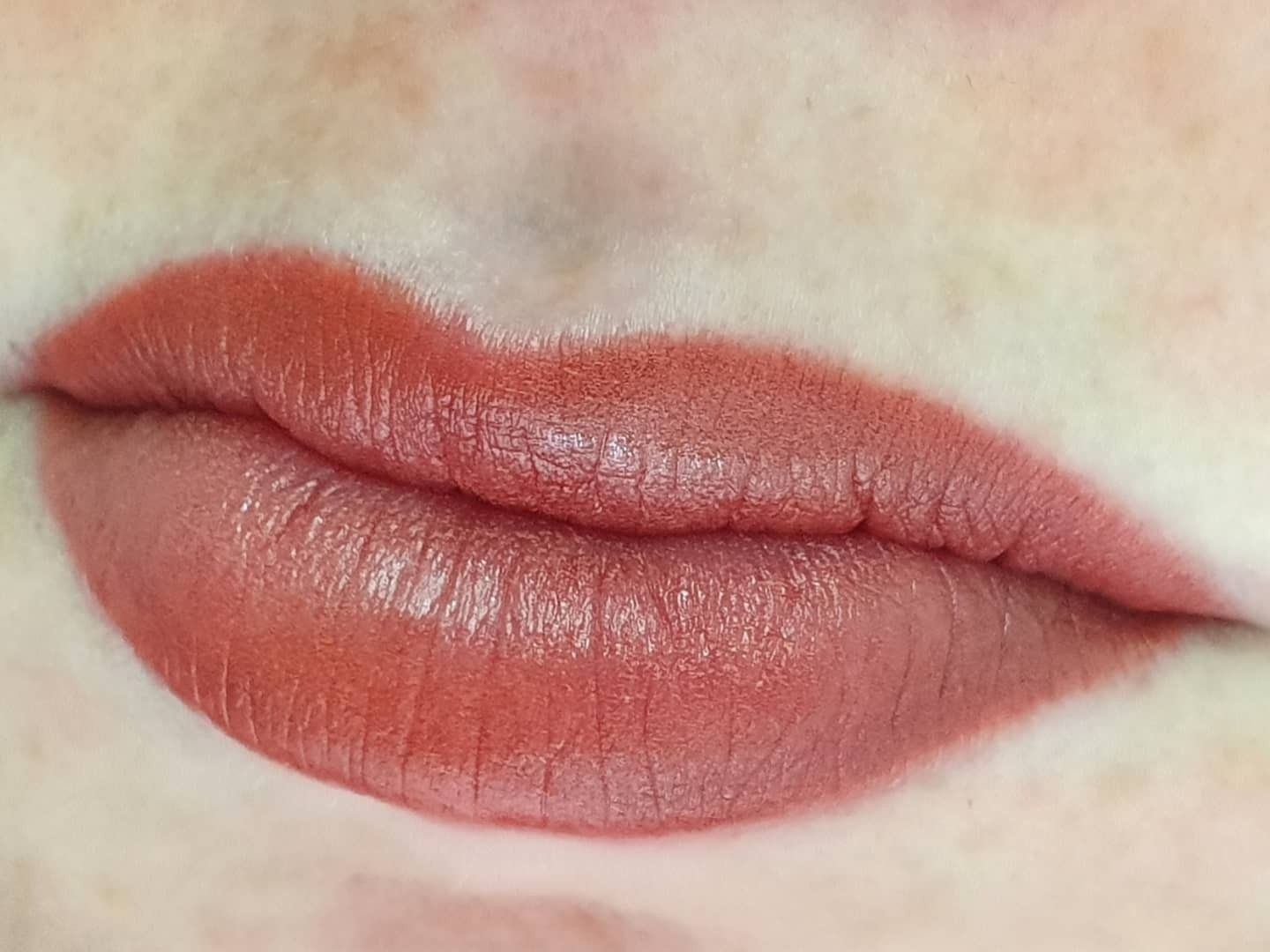 Close-up of closed lips with pinkish-red lipstick on a pale face — On Point Cosmetic Tattoo Studio In Buderim, QLD