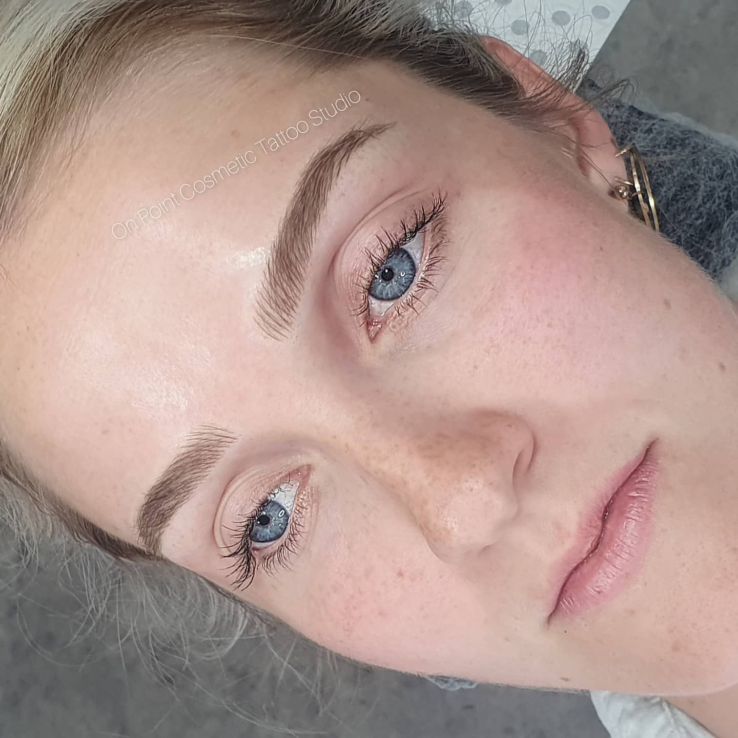 Close-up of a Person With Light Skin, Blue Eyes, and Microbladed Eyebrows — On Point Cosmetic Tattoo Studio In Buderim, QLD