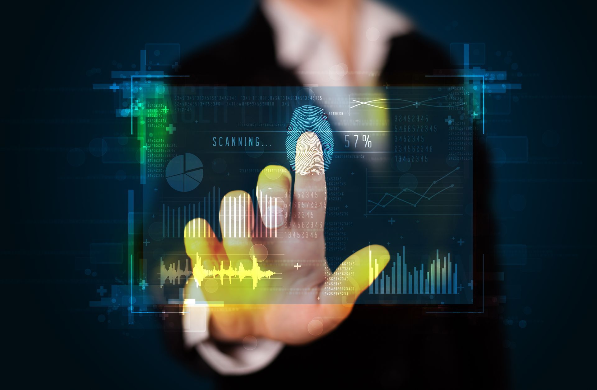 Businessperson touching a holographic analytics dashboard with charts and graphs