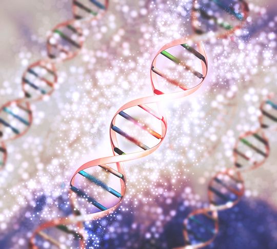 Colorful DNA double helix strands floating on a sparkling abstract background
