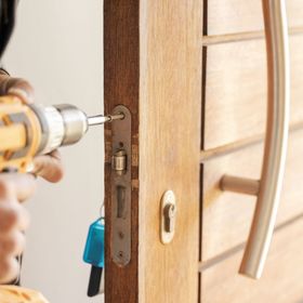 Rueschhoff Locksmiths can install or repair locks in your home. Image shows lock install.