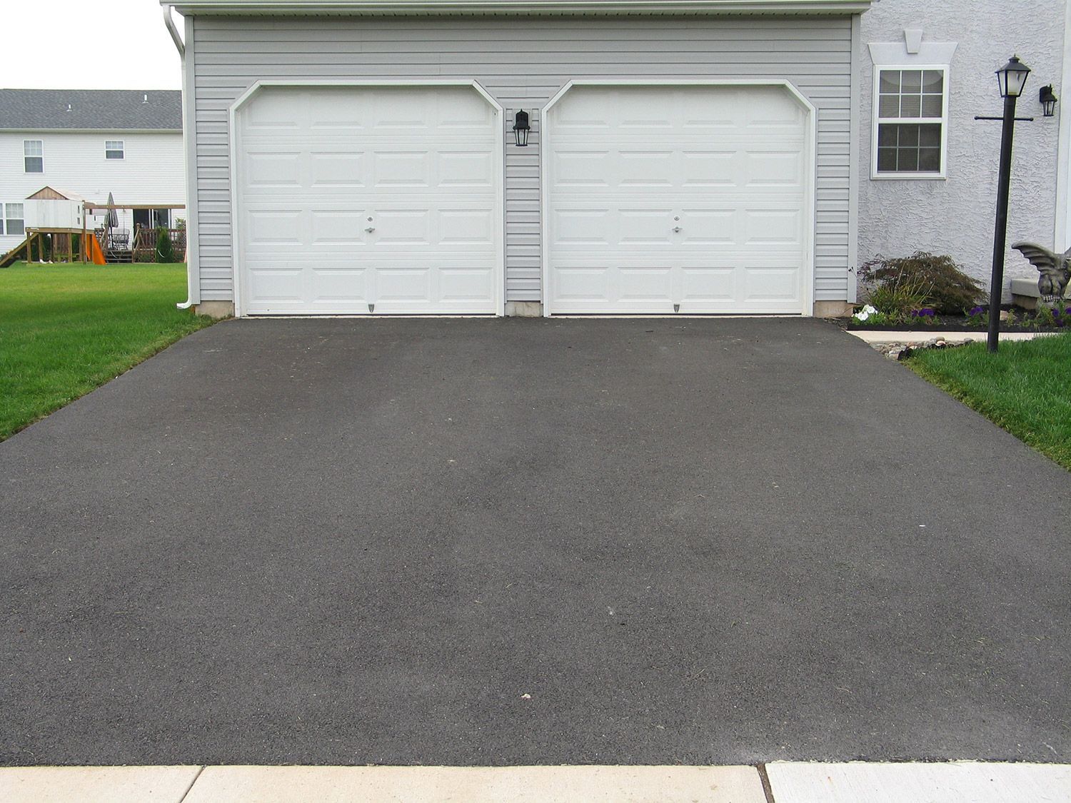 Minimal Asphalt Driveway — Harrisburg, NC — Bryer & Son Asphalt Paving Minimal Asphalt Driveway — Harrisburg, NC — Bryer & Son Asphalt Paving