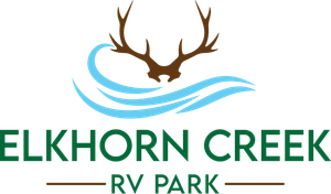 A logo for elkhorn creek rv park with antlers and waves.