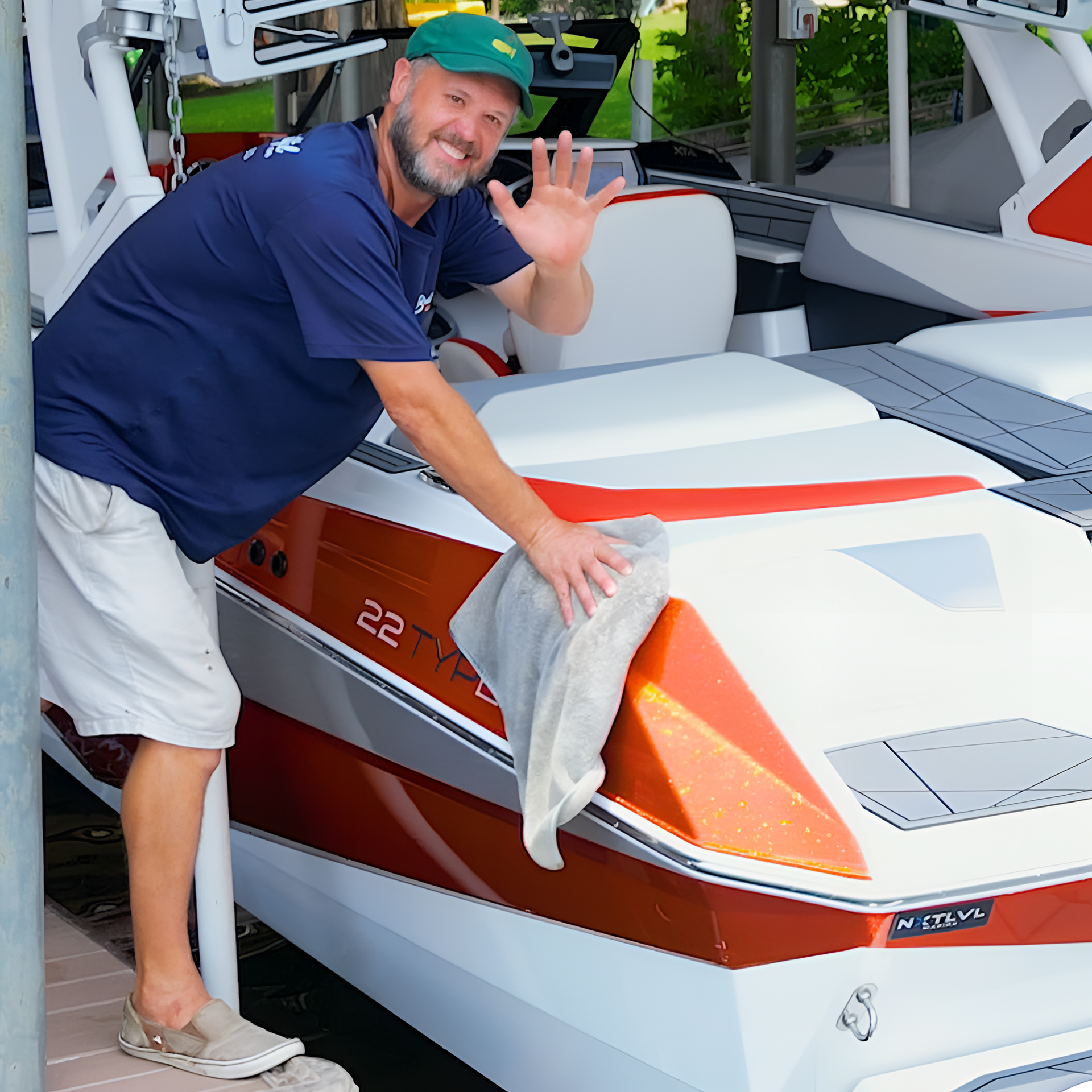 A man standing next to a boat with the number 22 on it