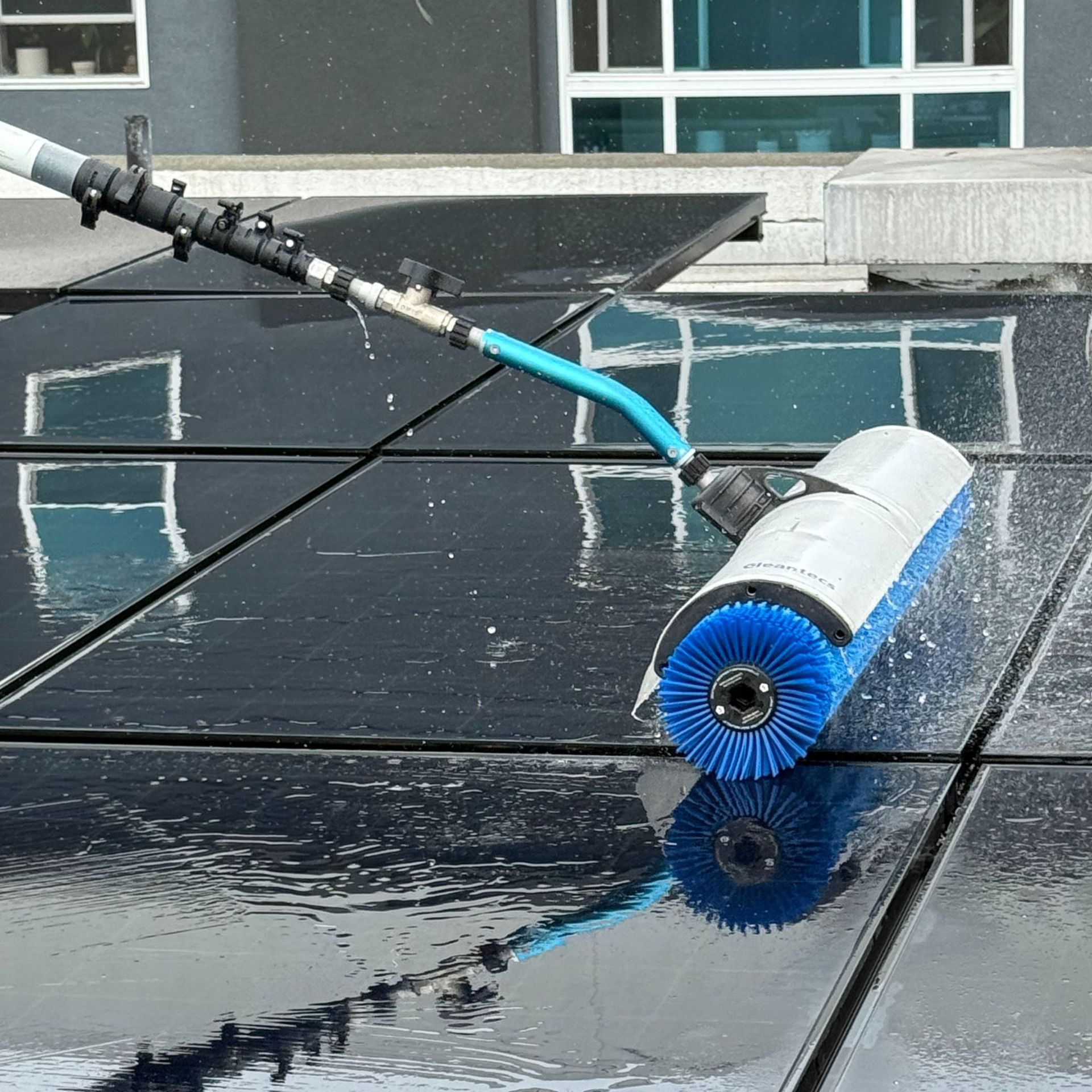 NFG Solar Panel Cleaning Company - A brush is being used to clean a solar panel