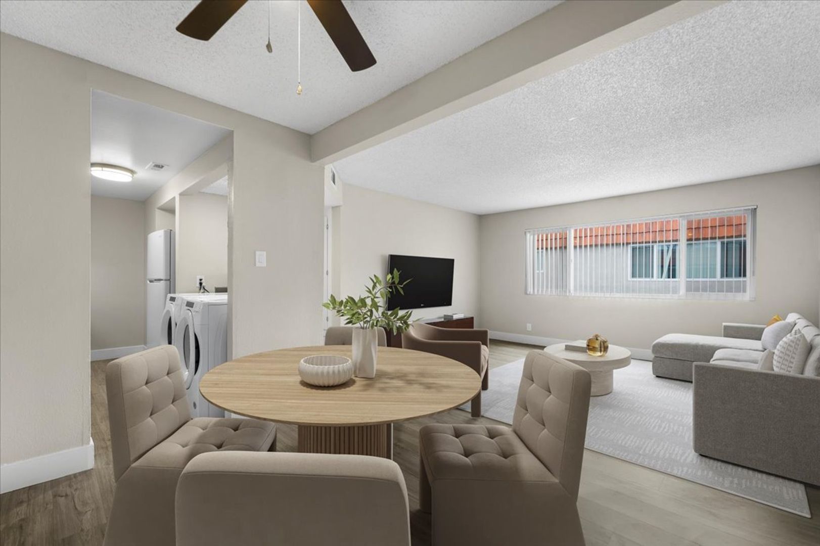 Spacious living room with large windows at Sherwood Forest Apartments