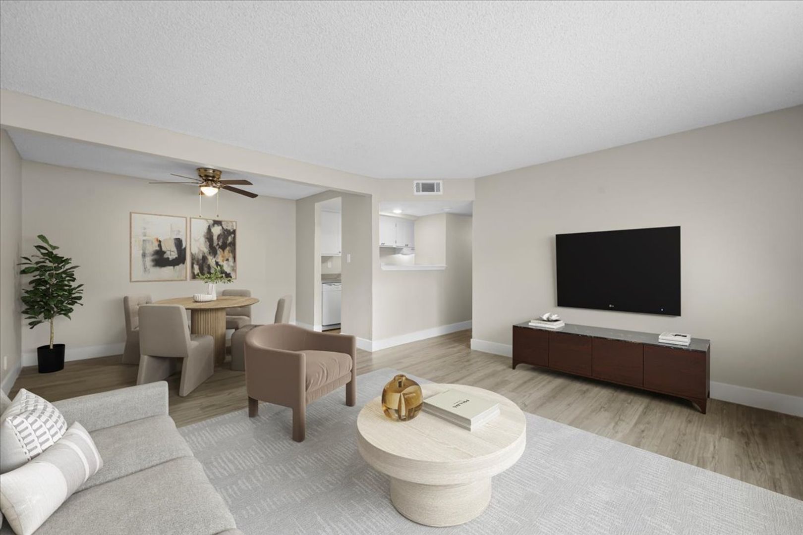 Spacious living room with large windows at Sherwood Forest Apartments
