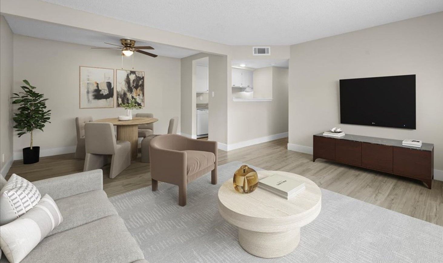 Spacious living room with large windows at Sherwood Forest Apartments