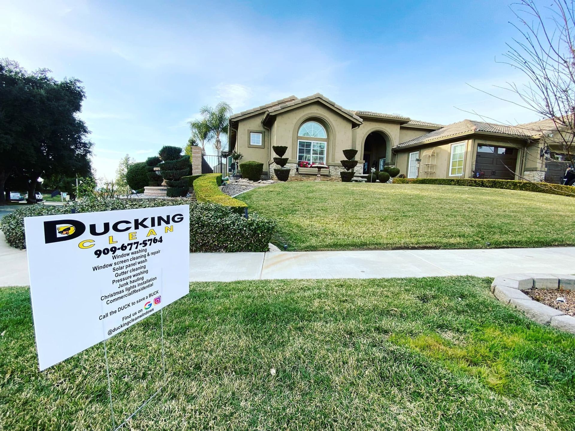 House with yard sign for “Duckino” in a suburban neighborhood