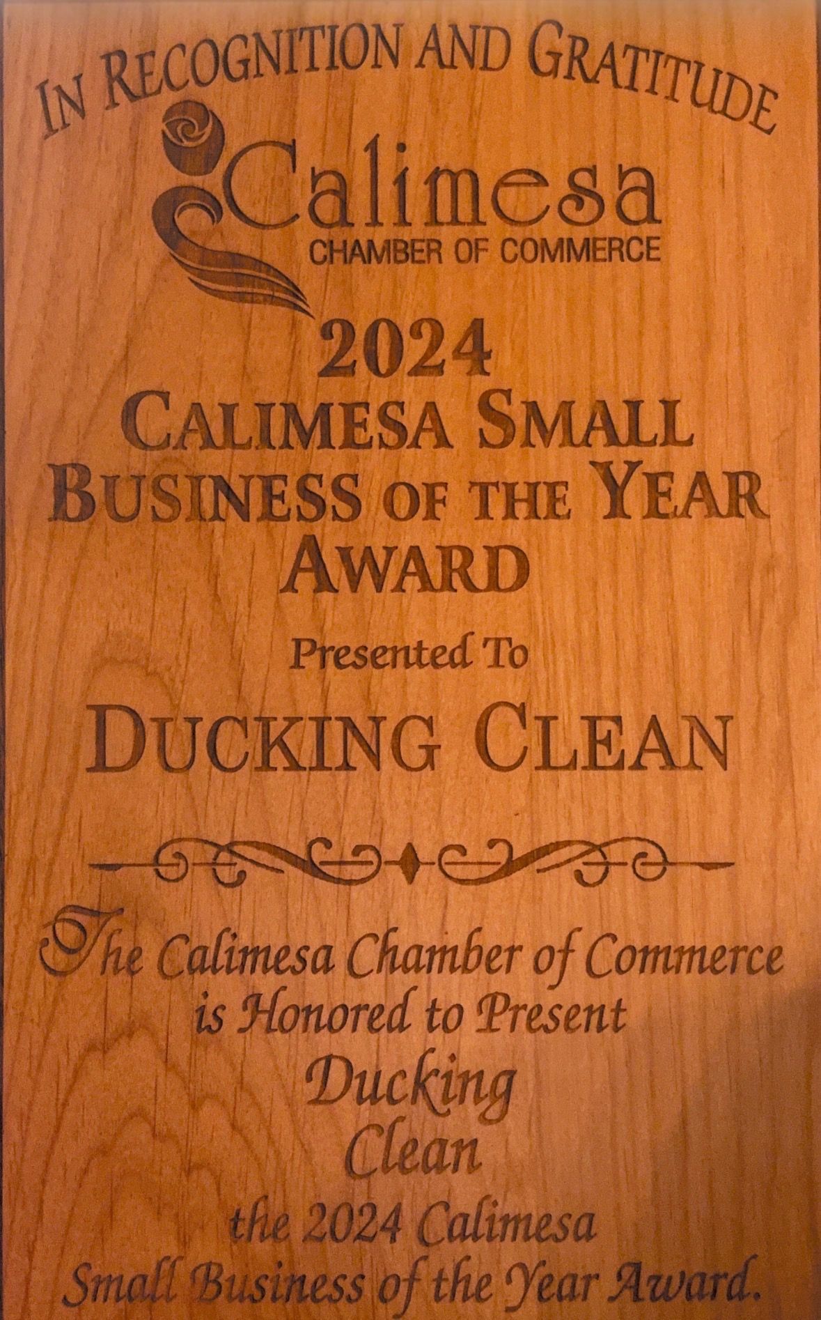 Wood plaque award from Calimesa Chamber of Commerce, 2024 Small Business of the Year, for Ducking Clean