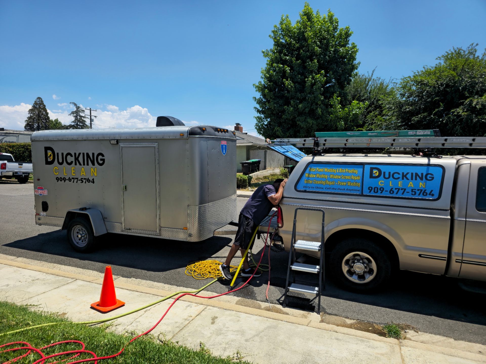 Ducking Clean truck washing setup with worker cleaning a silver pickup in Calimesa, CA