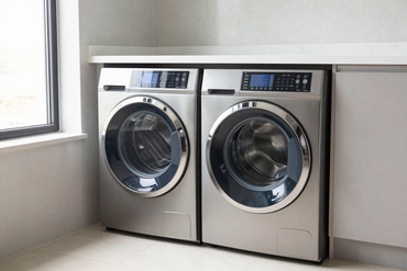 Stacked washer and dryer in a bright laundry room