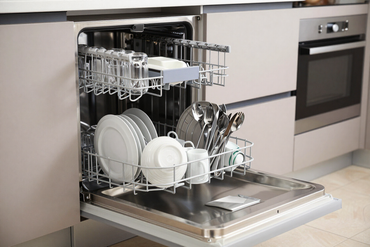 Dishwasher interior loaded with clean dishes