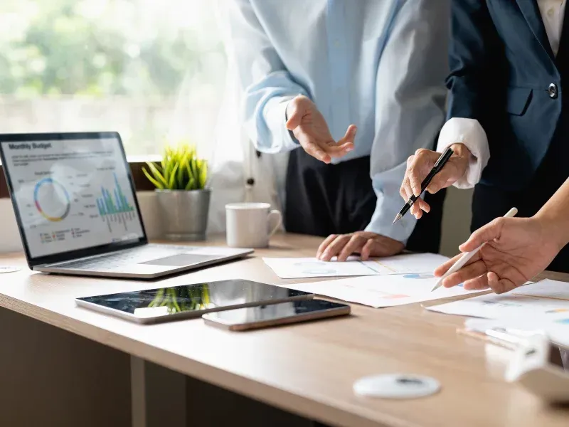 An image showing a business team discussing enterprise SEO strategies in an office setting.