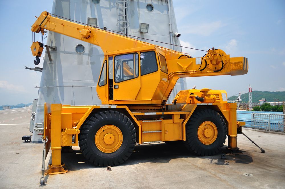 Yellow Mobile Crane on a Concrete Surface, Boom Extended — Statewide Lift & Shift Pty Ltd In Paget, QLD