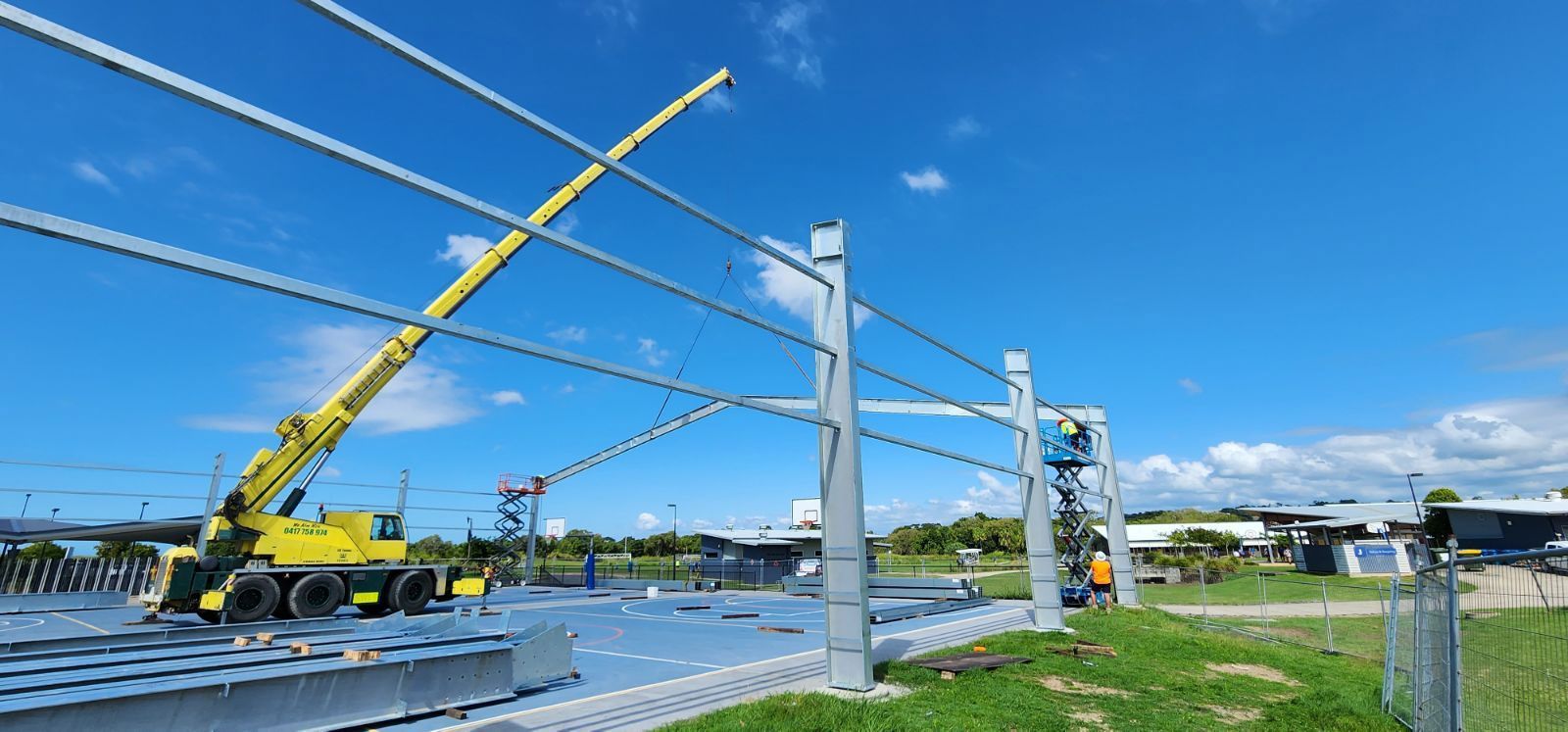 Construction Site With Crane, Metal Framework, and Blue Sky — Statewide Lift & Shift Pty Ltd In Paget, QLD