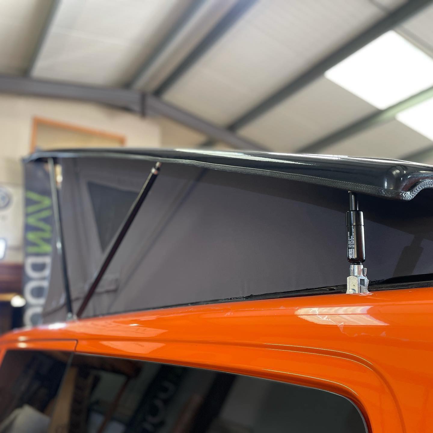 Stealth low profile pop top roof