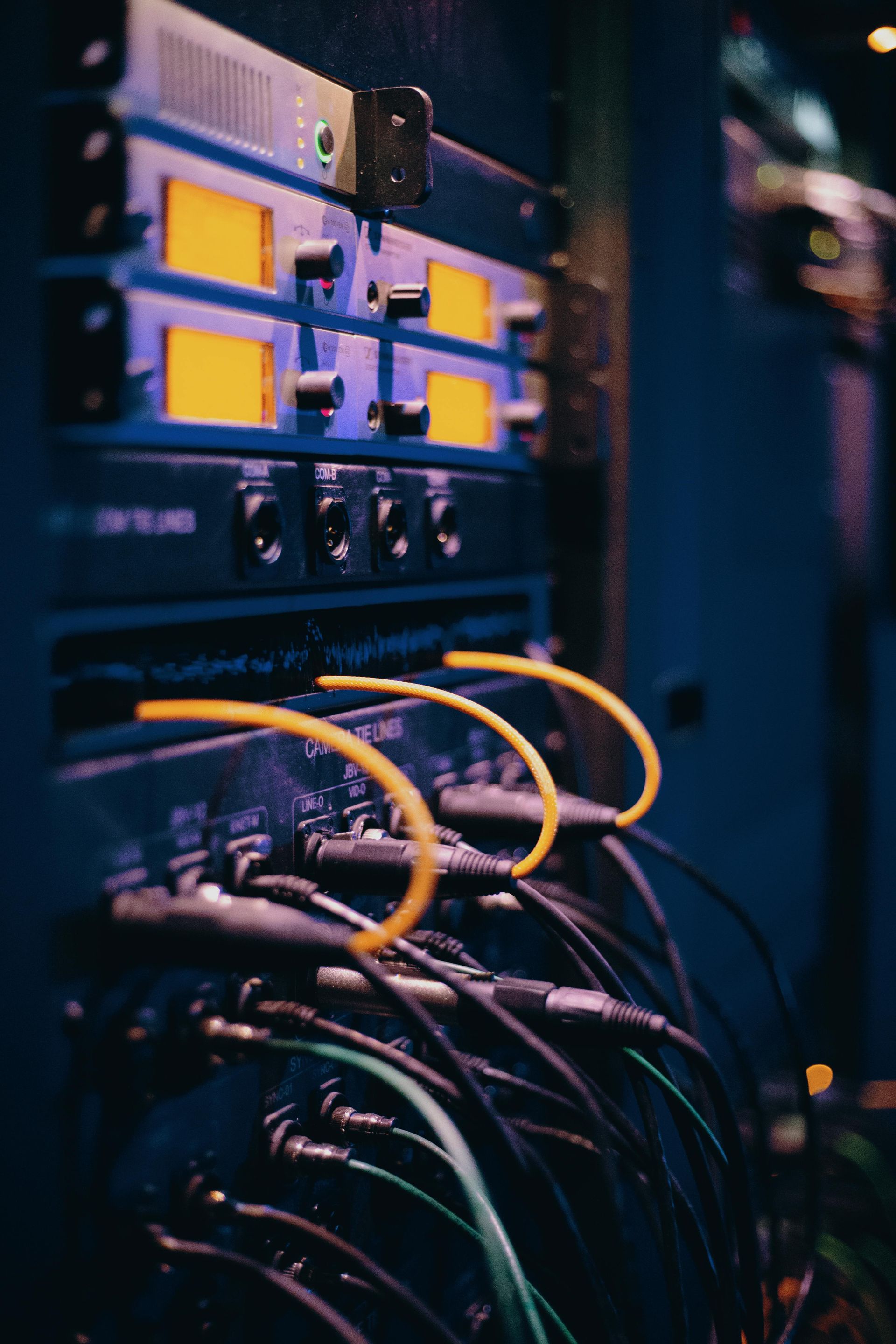 A bunch of wires are connected to a server in a data center.