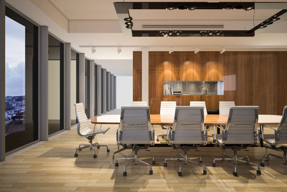 Modern Conference Room With Large Windows, and a Long Table With Chairs — White Rose Electrical in Coffs Harbour, NSW