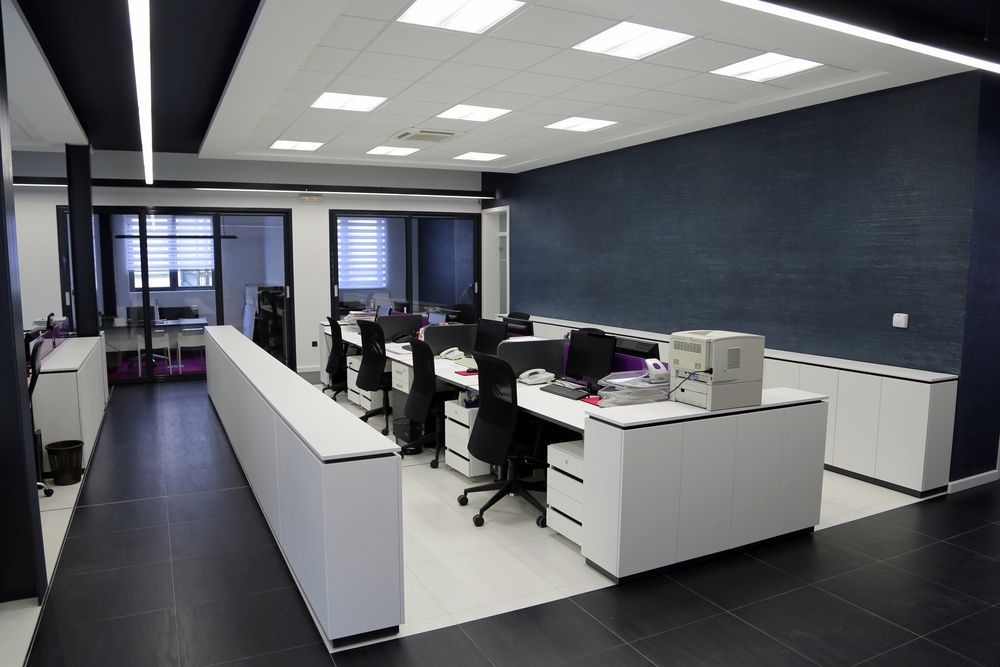 Modern Office Space With Desks, Chairs, and Computers — White Rose Electrical in Coffs Harbour, NSW