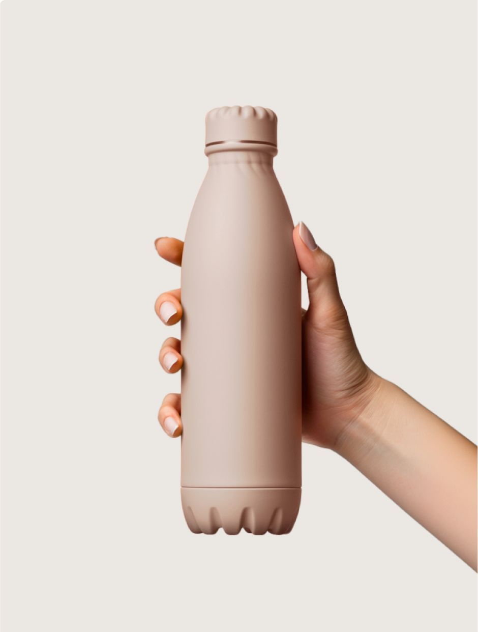 Hand holding a beige insulated water bottle against a light background.