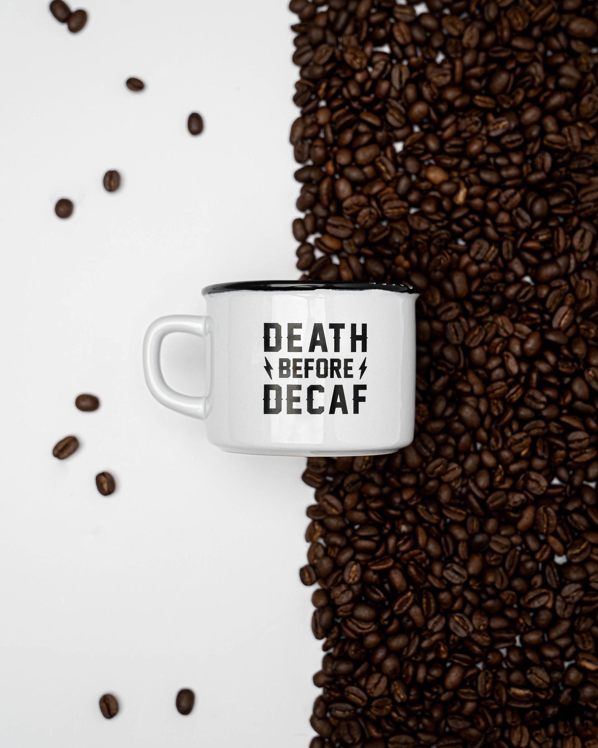 flatlay of coffee cup with coffee beans surrounding brand photography for American motorcycle company 