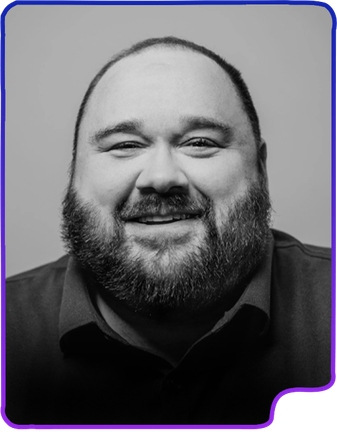 black and white relaxed headshot wiht man smiling