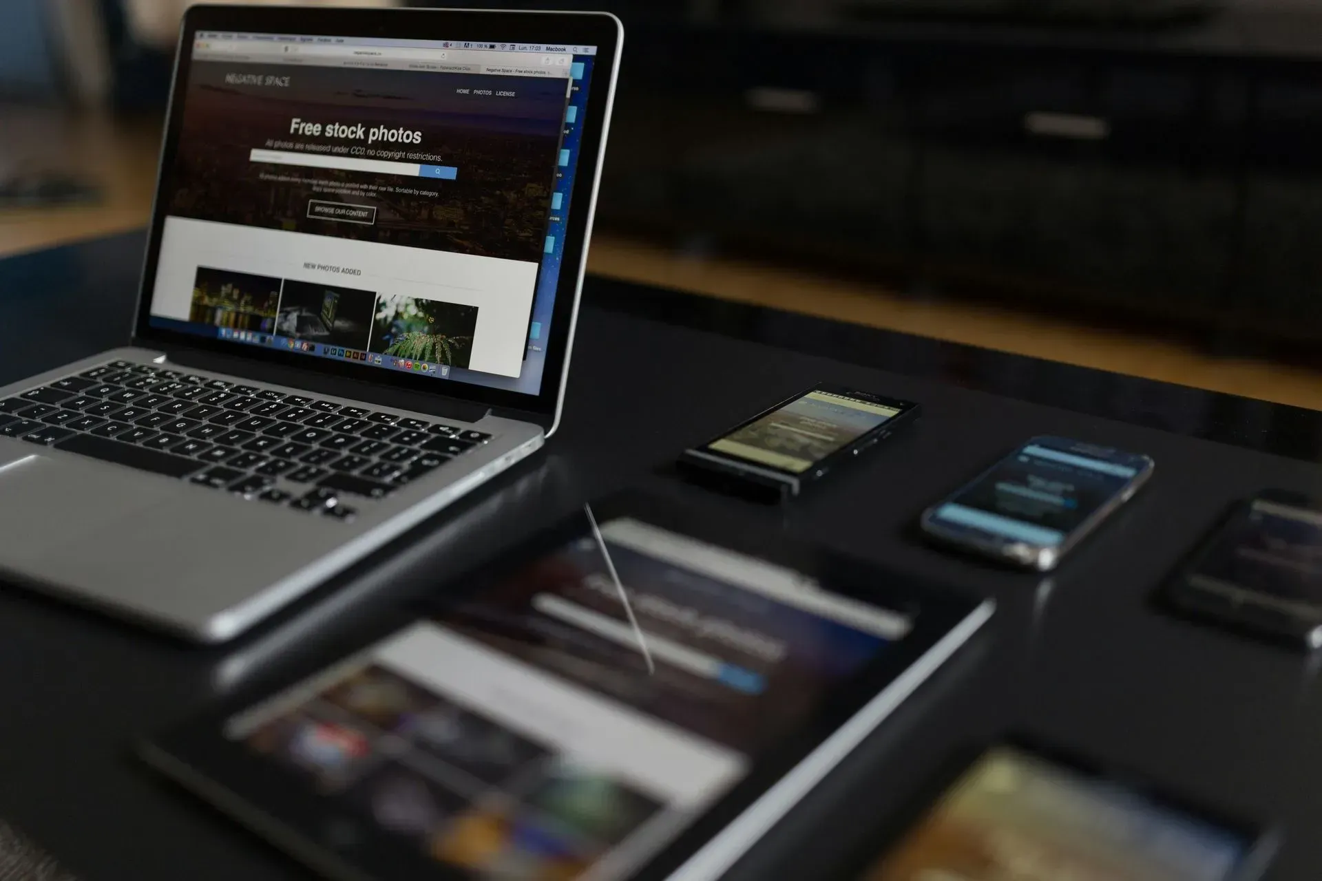 laptop next to a tablet with a photo gallery