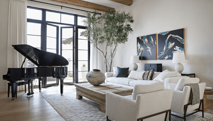 A grand piano placed in a modern living room with natural lighting, wooden beams, and stylish decor, illustrating a stable and aesthetically pleasing piano placement