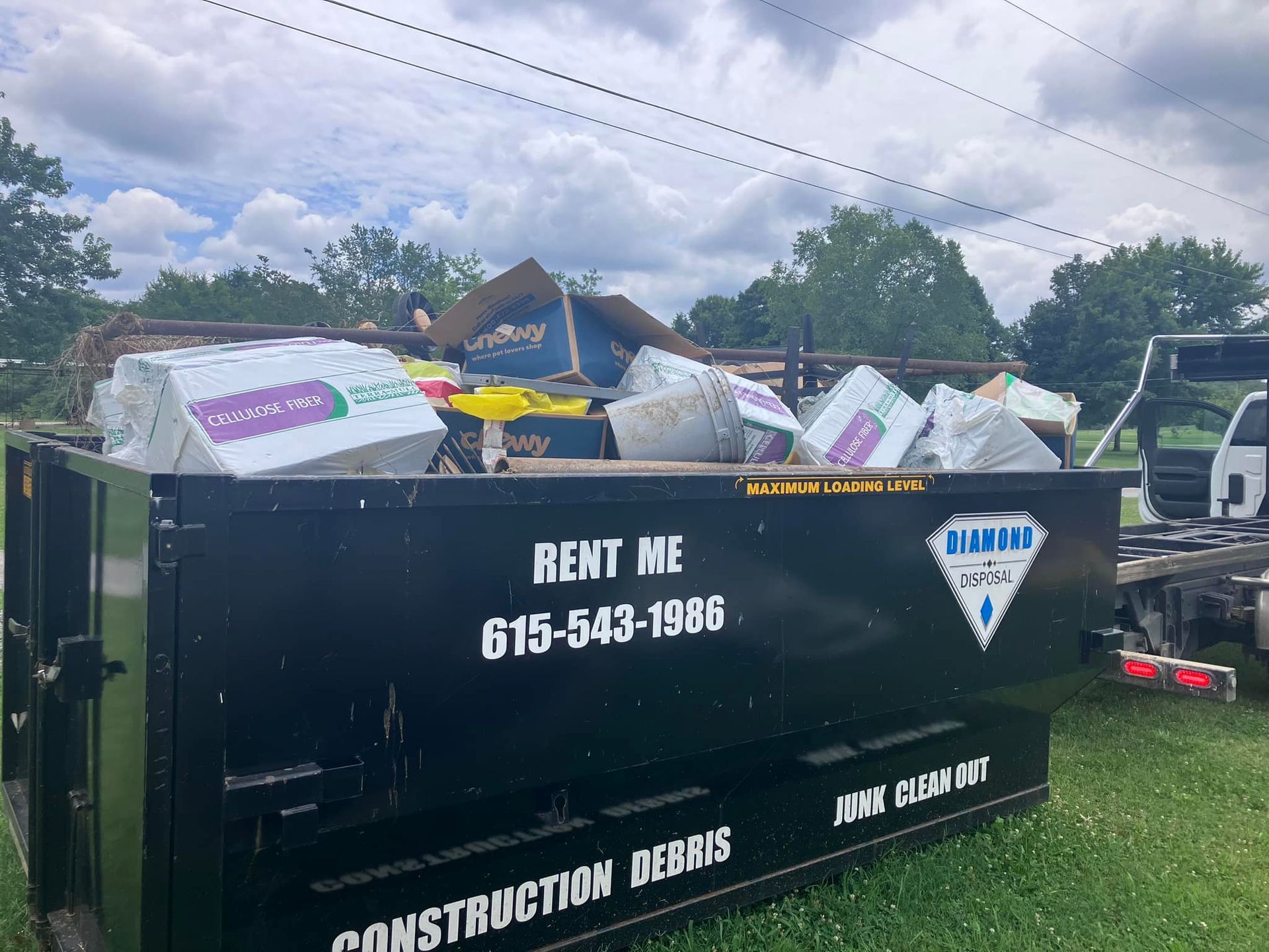 A black construction dumpster with