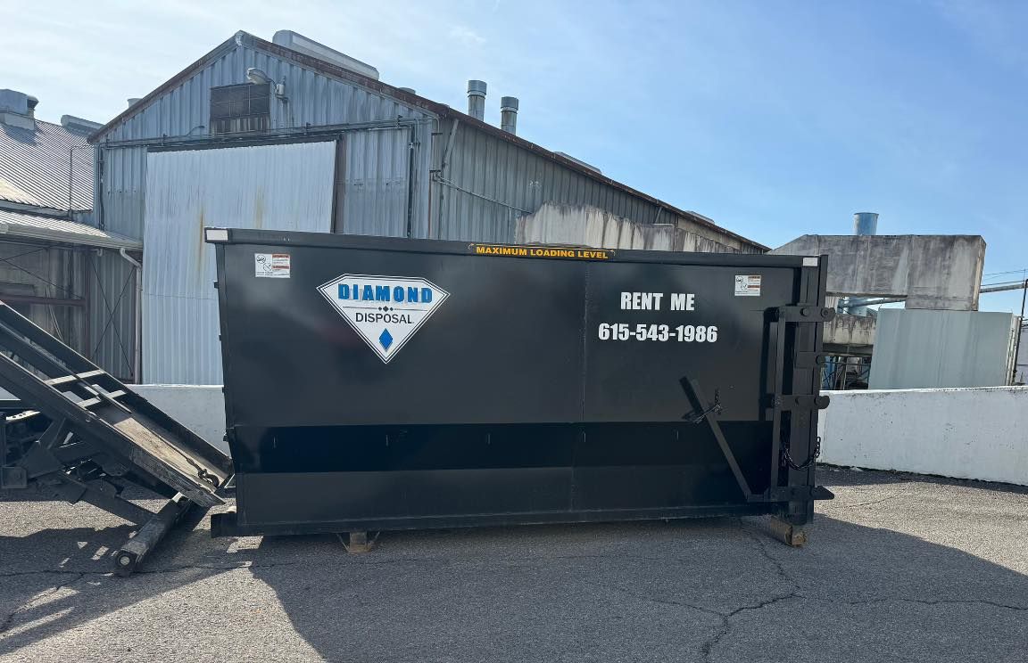 A black industrial dumpster with