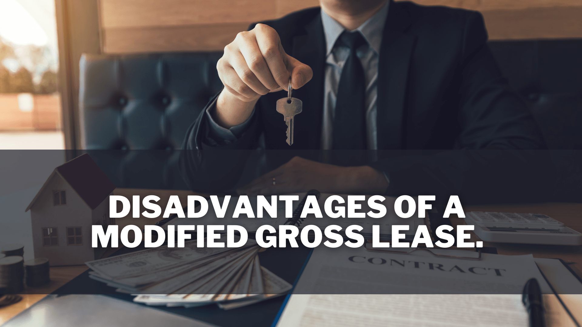 Man handing over keys after reviewing a modified lease.