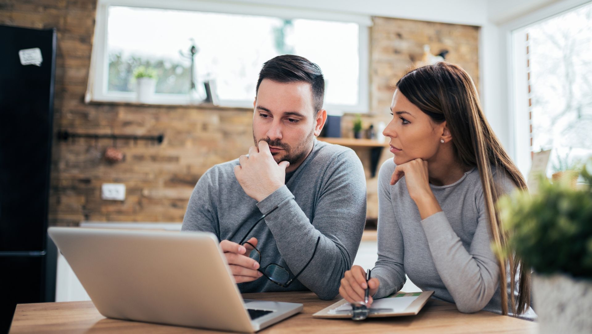 Redding CA landlords reviewing property management options at home - Authority Property Management
